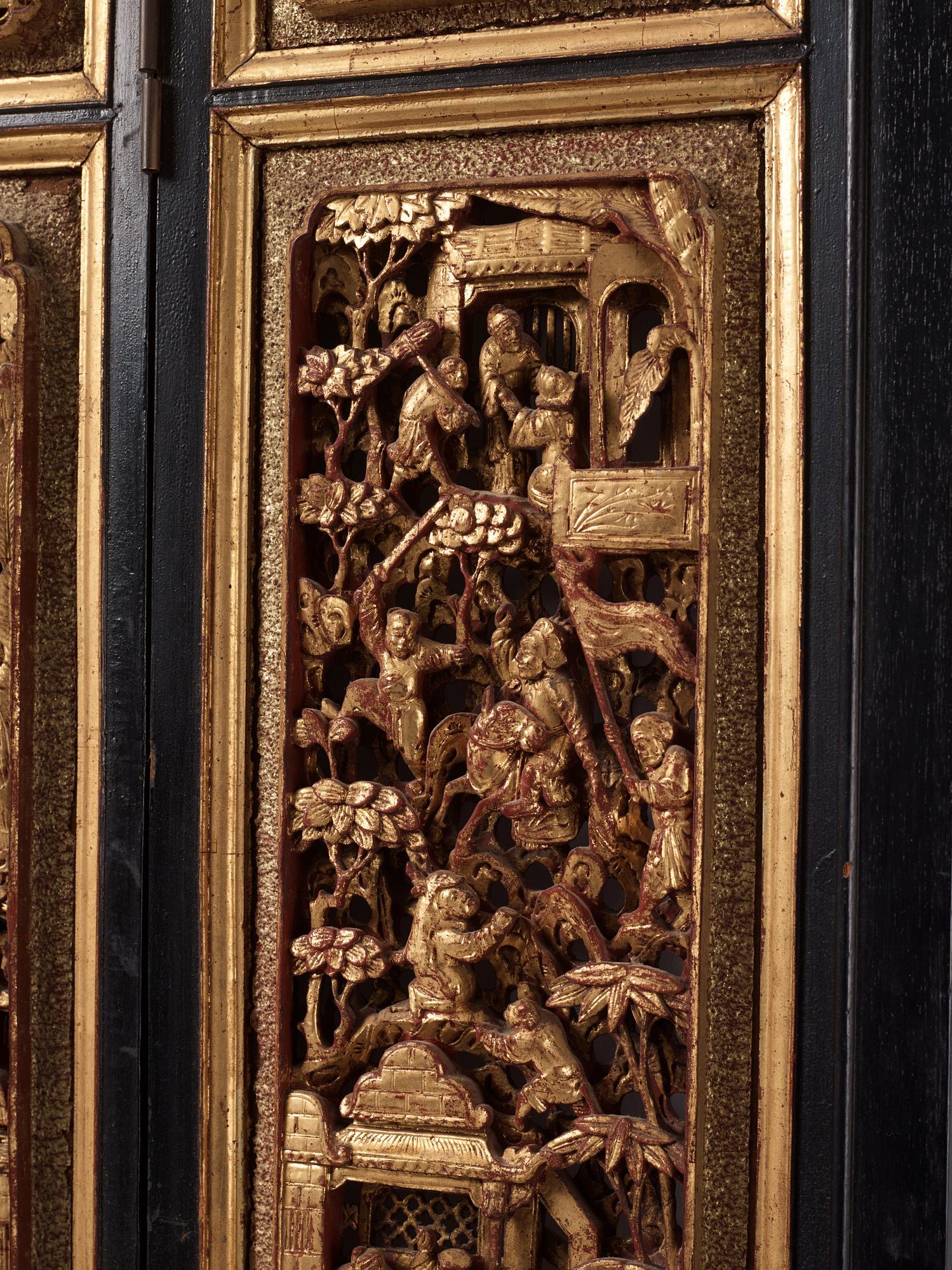 A set of four framed wooden panels, Qing dynasty, 19th Century.