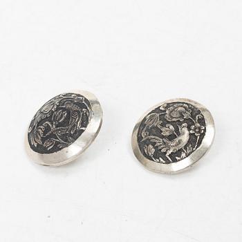 Two silver buttons, a belt buckle, an armring and a box, Persia, first part of the 1900s.