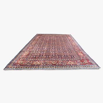 A carpet, a semi-antique Tabriz, ca 357 x 255 cm.