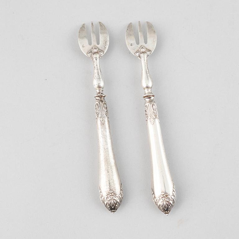 A set of twelve French 19th centurey silver oyster forks.