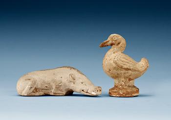 1628. A potted figure of a duck and a wild boar, Tang dynasty (618-907).