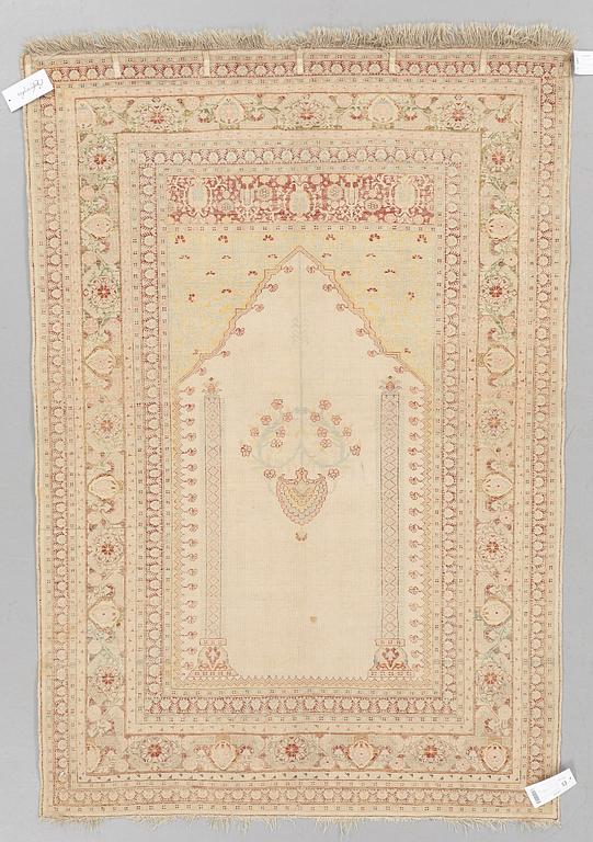 A RUG, an antique silk Tabriz, ca 165 x 118,5-111,5 cm.