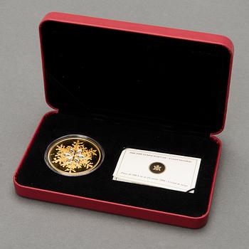 A Canadian 'Crystal Snowflake' 300 Dollar jubilee gold coin.