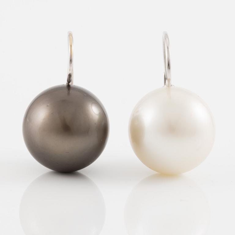 Earrings with cultured Tahitian and South Sea pearls.