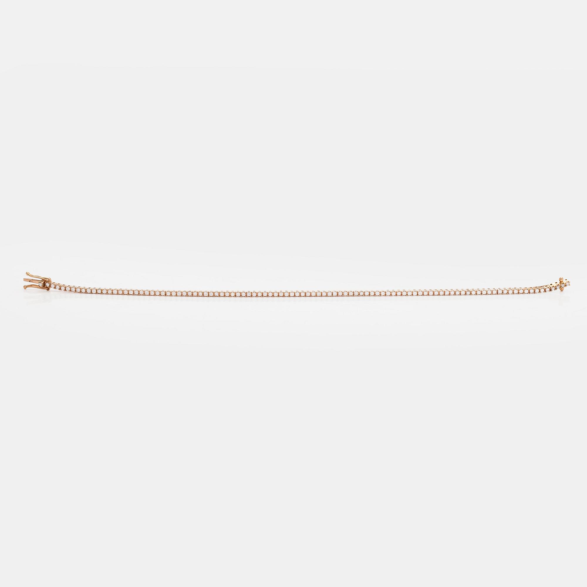 An 18K rose gold tennis bracelet with brilliant cut diamonds.
