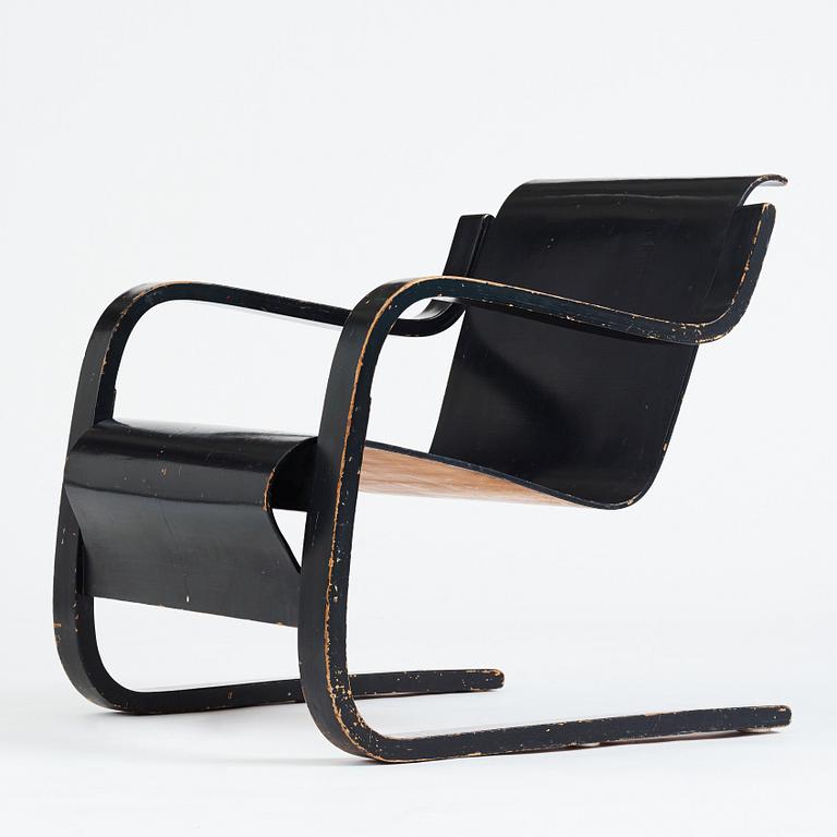 Alvar Aalto, a black lacquered birch cantilevered armchair, "nr 42", O.y Huonekalu-ja Rakennustyötehdas, Finland, 1930's.