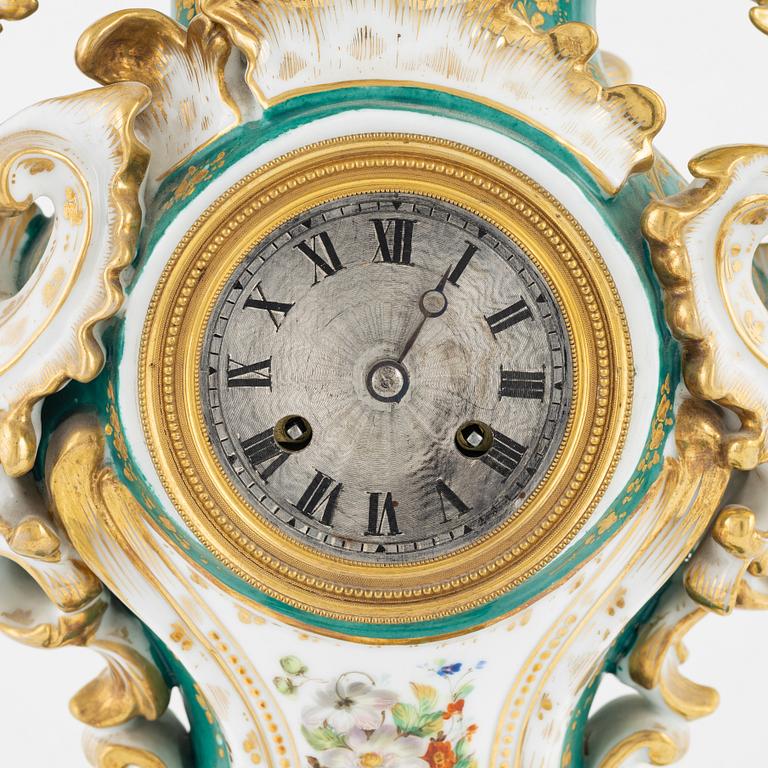 A porcelain mantle clock from around the year 1900.