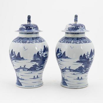 A pair of blue and white Chinese porcelain jars with covers. Qing dynasty, Qianlong (1736-95).