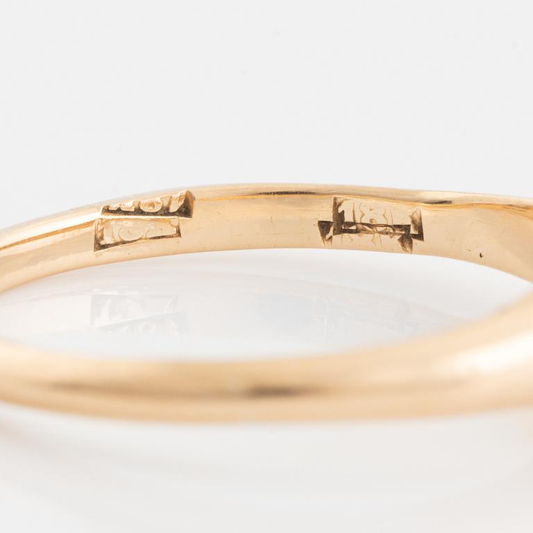 Ring, 18K gold with faceted white stone.