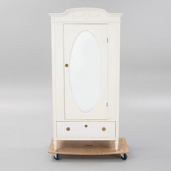 A Gustavian style cabinet, first half of the 20th Century.