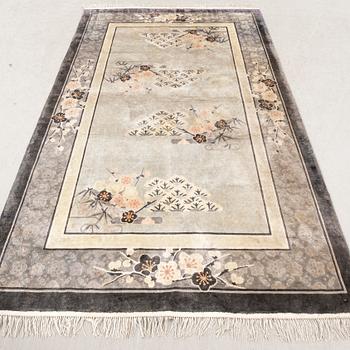 A Chinese old silk carpet ca 240x153 cm.