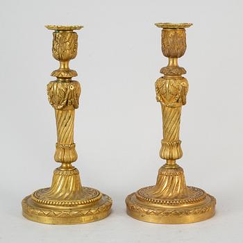 A pair of Louis XVI style candlesticks. Ca 1900.