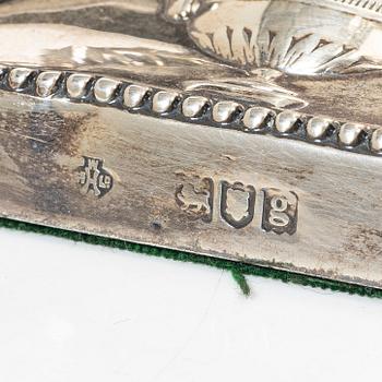 A pair of English silver candlesticks, mark of William Hutton & Sons Ltd, London 1902.