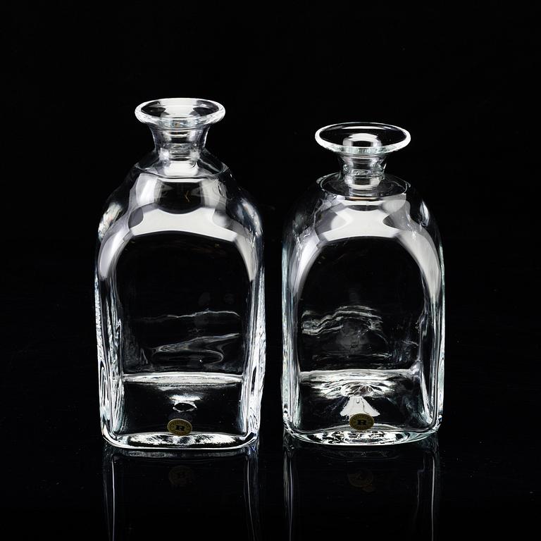 A set of twelve "Antik" shot glasses and two decanters by Reijmyre Glasbruk.