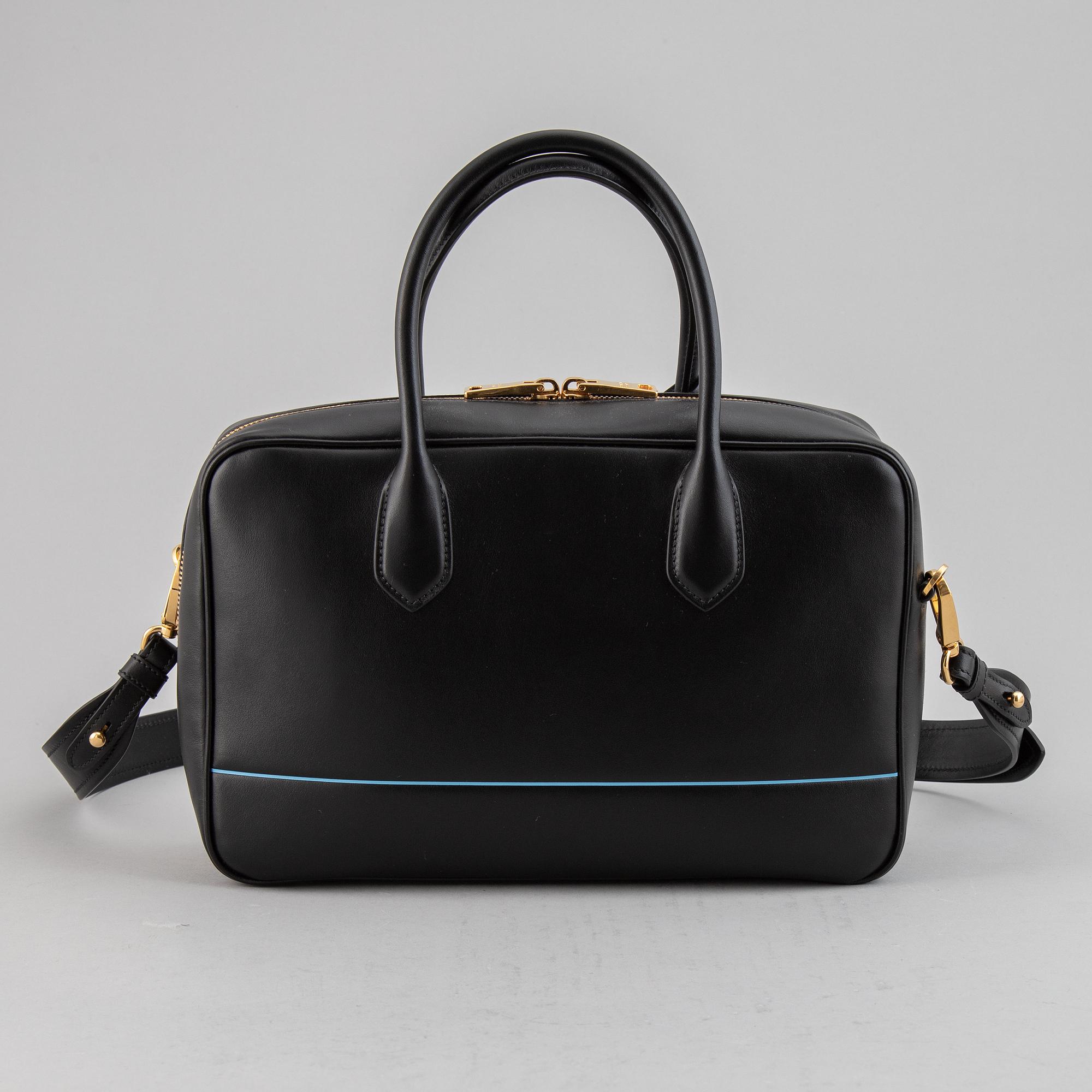 PRADA, a leather bag.