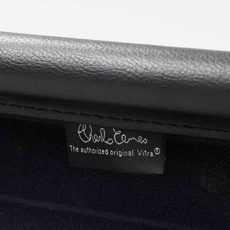 An EA 108 swivel office chair by Charles and Ray Eames for Vitra.