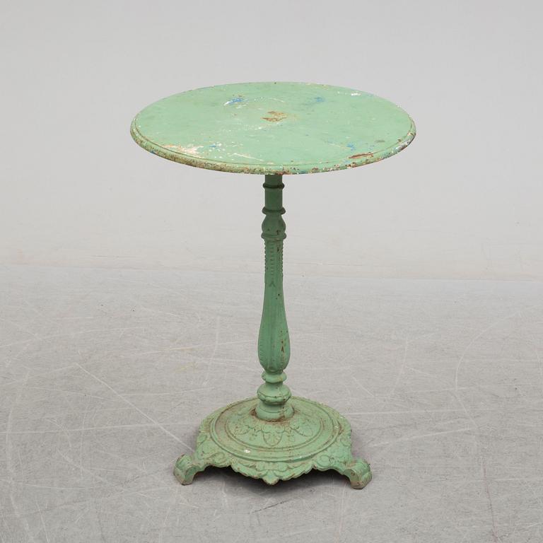 A circa 1900 iron table.