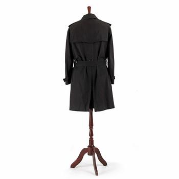 BURBERRY, a black cotton trenchcoat.