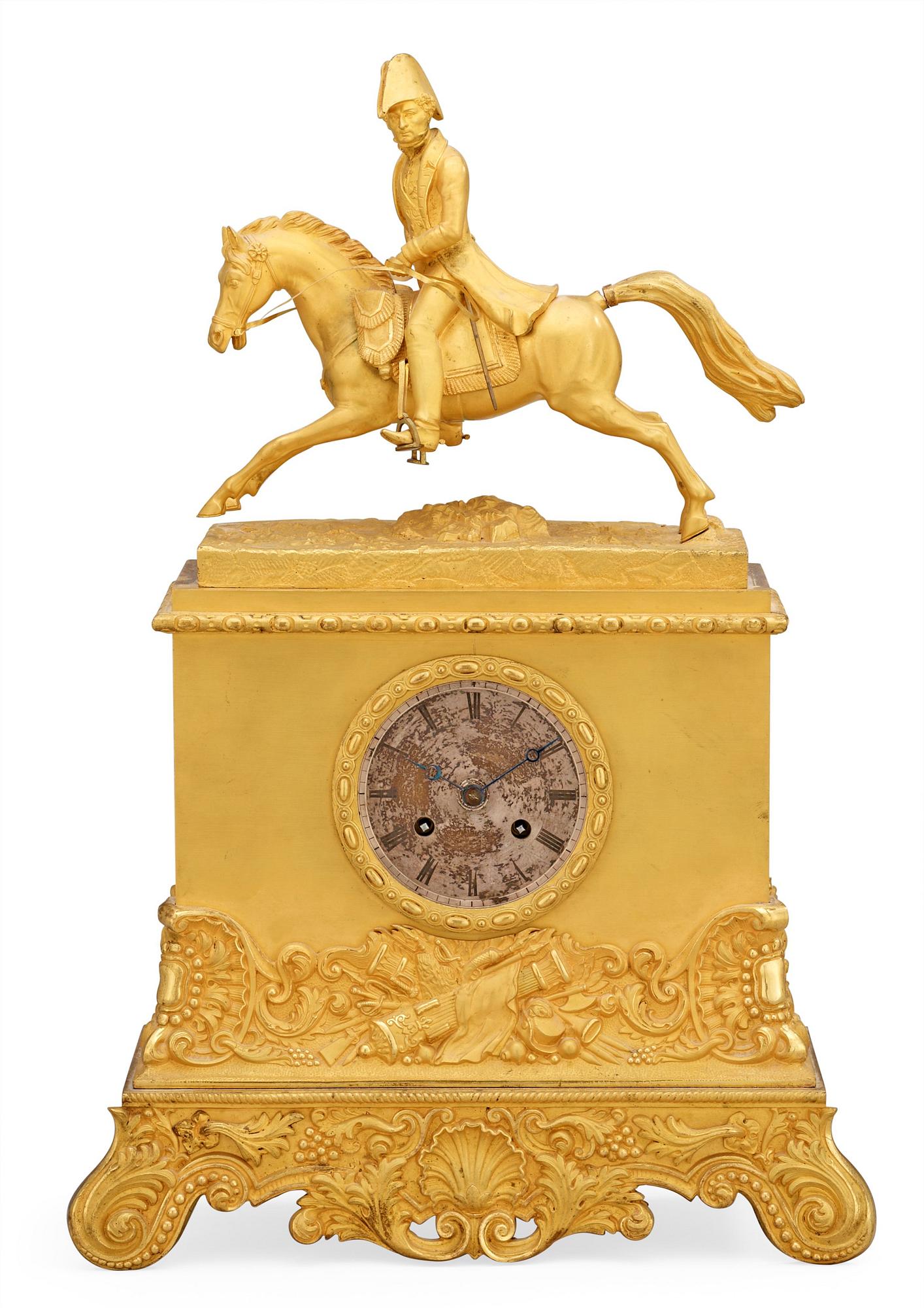 A Swedish Empire Equestrian gilt bronze mantel clock depicting king Karl XIV Johan.