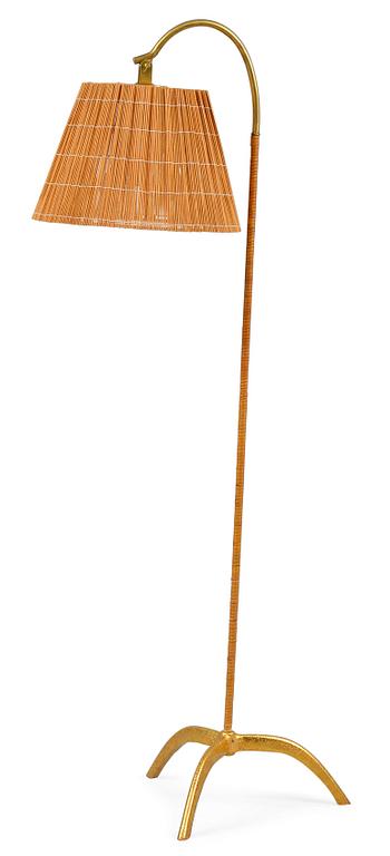 Paavo Tynell, PAAVO TYNELL (FINLAND), A FLOOR LAMP. brass. Rattan covered pole and shade made of splints. Oy Taito Ab.