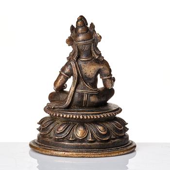 A copper alloy figure of Jambhala, Nepal, possibly 12/13th Century.