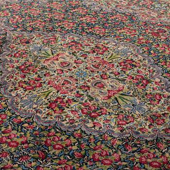 A semi-antique Kerman, around 351 x 269 cm.