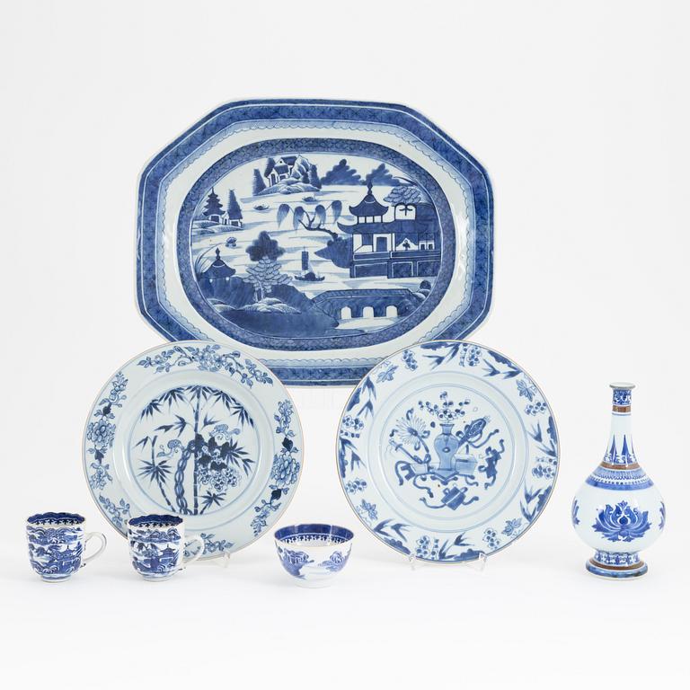 A group of Chinese blue and white porcelain: dish, vase, three cups and two plates. 18th and 20th century.