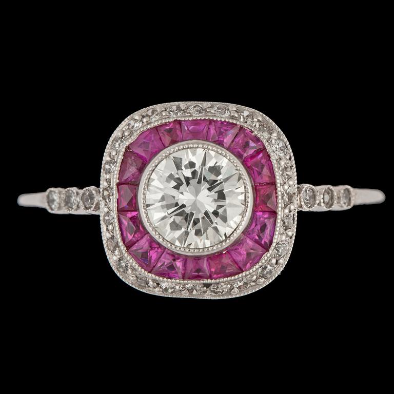 RING, briljantslipad diamant, 0.63 ct, med bård av rubiner.