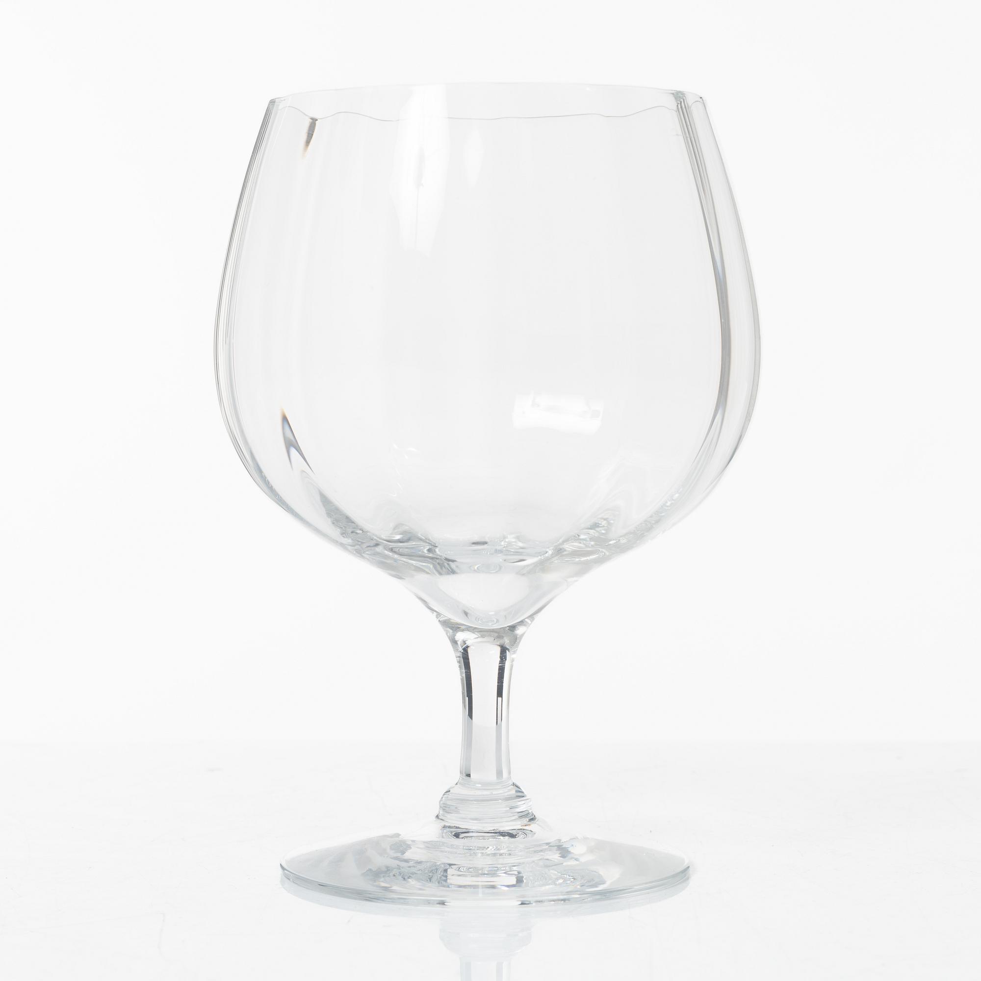 A set of 46 glass service parts, including 'Elixir Connoisseur' and Gunnar Cyrén, 'Optica', Orrefors.