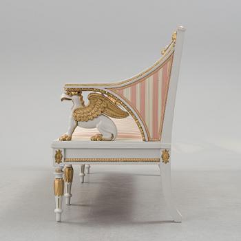 A set of two armchairs, a sofa, a stool and a chair. Early 20th century.