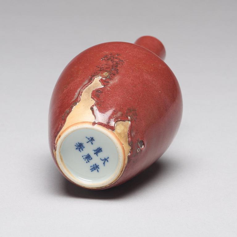 A sang de boef vase and bowl and an enamelled cup with cover and stand, Qing dynasty (1664-1912).