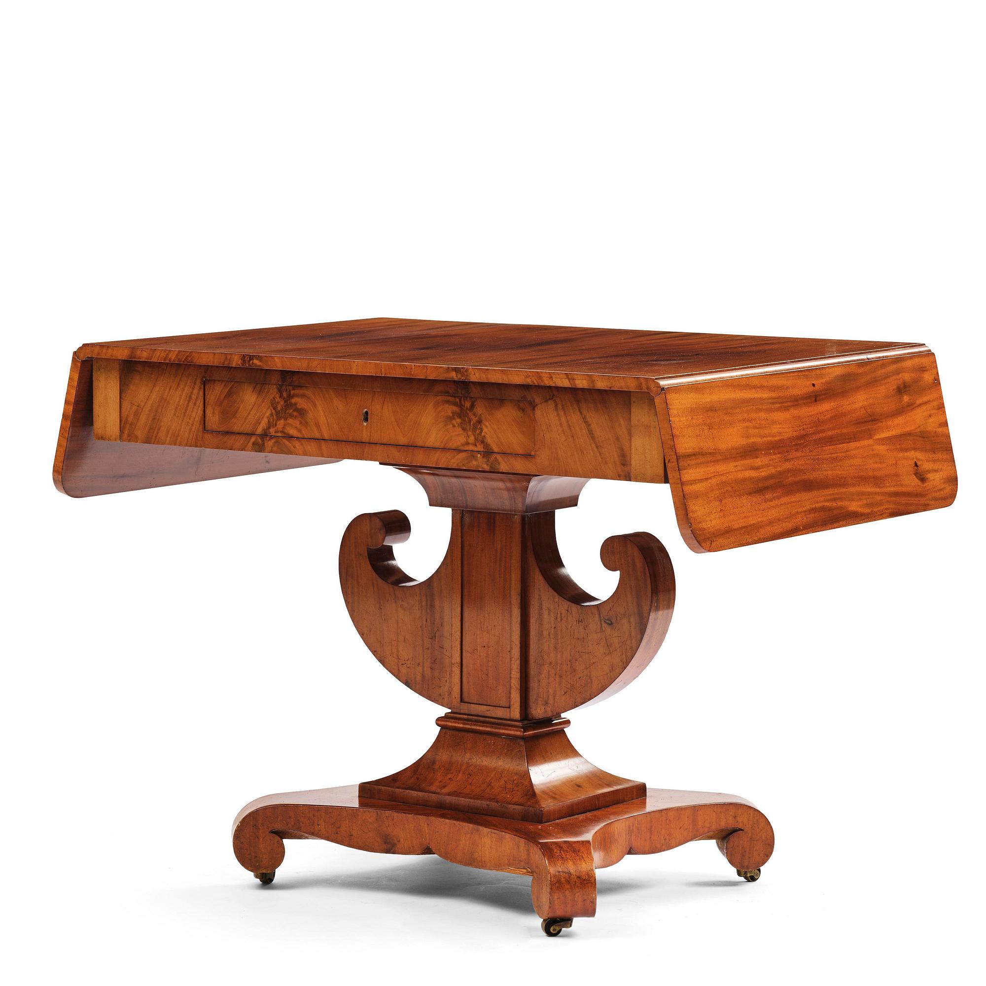 A Swedish Empire mahogany center table.