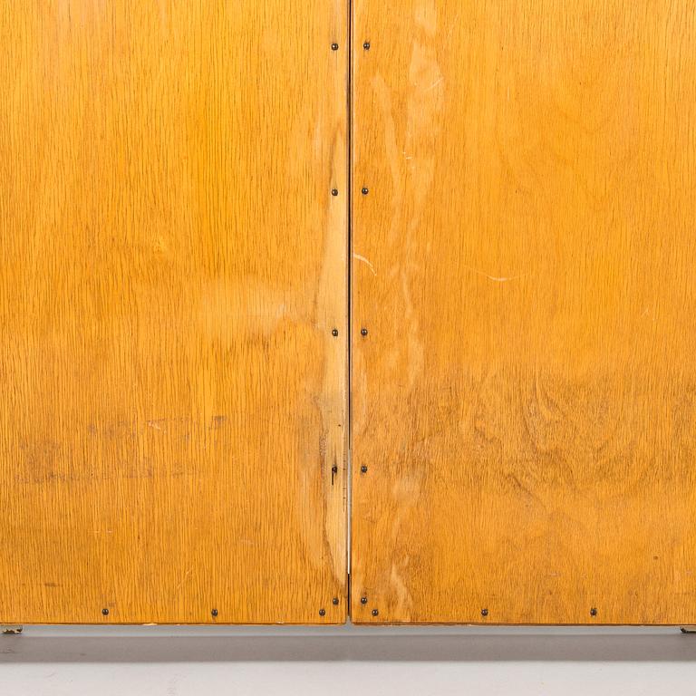 A 1950s three-part dressing mirror.