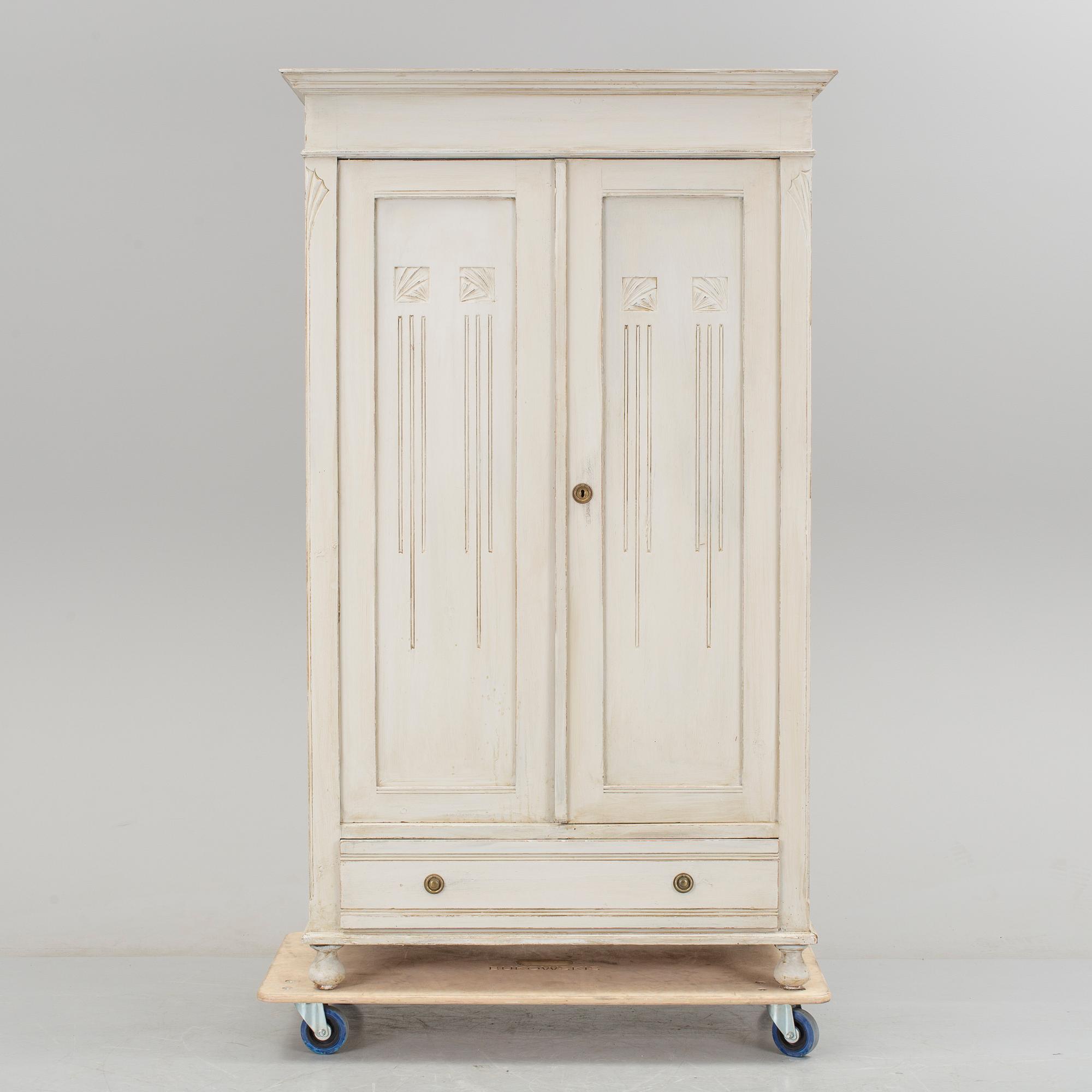 A wardrobe, circa 1900.