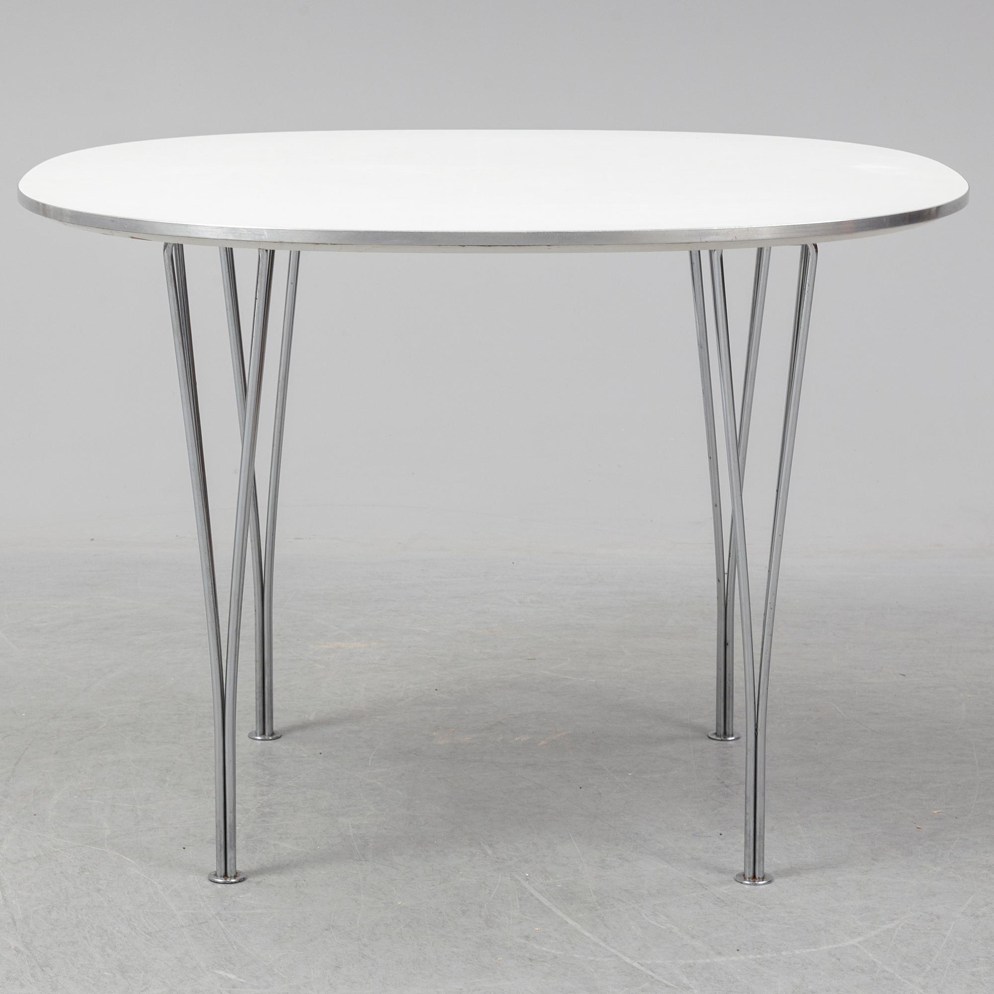 A table by Bruno Mathsson and Piet Hein for Fritz Hansen dated 1990.