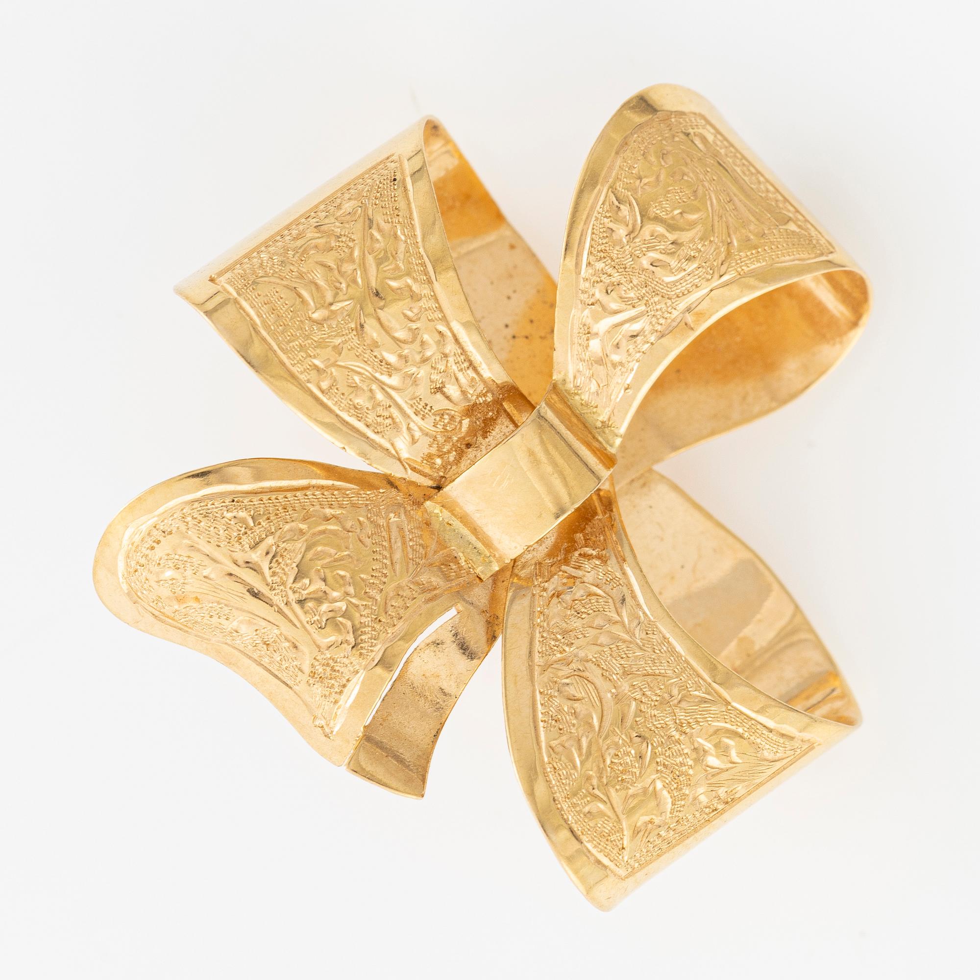 Brooch, 18K gold in the form of a bowknot.