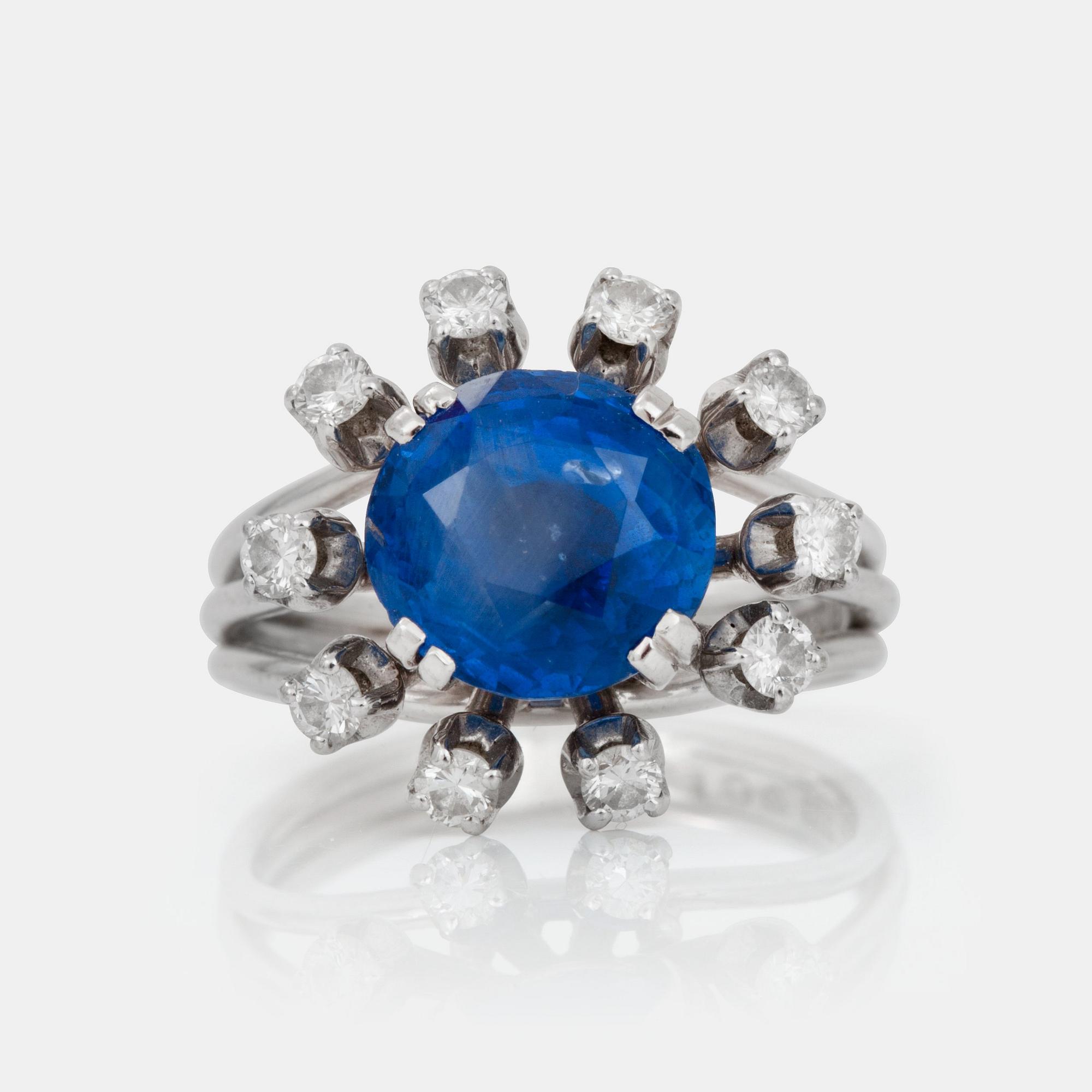 A sapphire and brilliant-cut diamond ring.