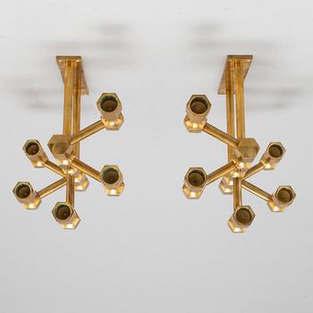 A pair of brass wall candelabras, for Gusum, signed BK and dated 1995 and 1997.