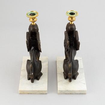 A pair of bronze and marble Empire style candlesticks, first part of the 20th Century.