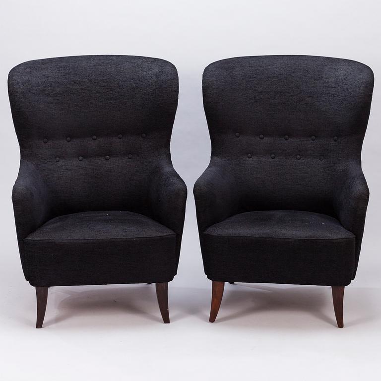 A pair of mid-20th century armchairs.