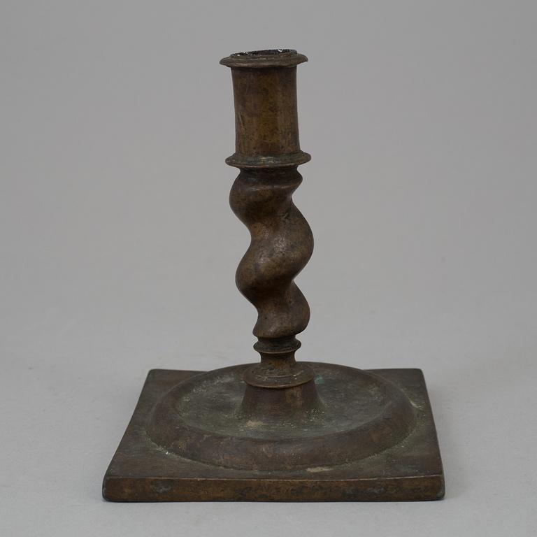 AN 18TH CENTURY BAROQUE CANDLESTICK.