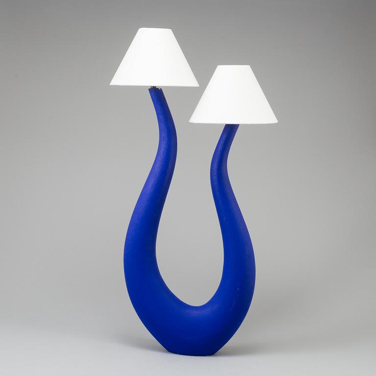 a "Lyre" table lamp by Philippe Cuny.