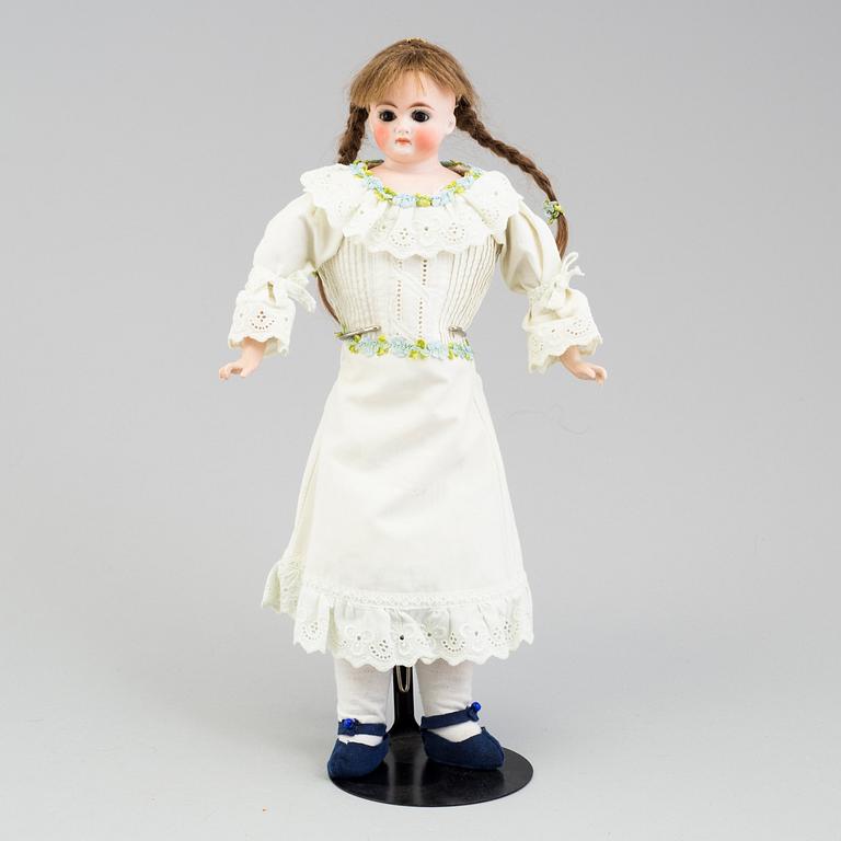 a German porcelain doll from the early 20th century.