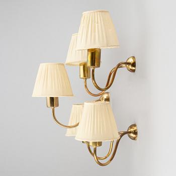 Three brass wall lamps, model 2335 and 2334, by Josef Frank, Firma Svenskt Tenn.