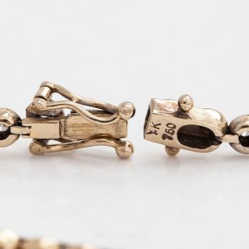 Tennisrannekoru, 18K kultaa ja timantteja yhteensä noin 0.78 ct.
