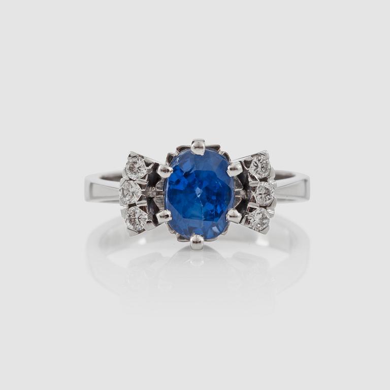 A sapphire and brilliant-cut diamond ring.