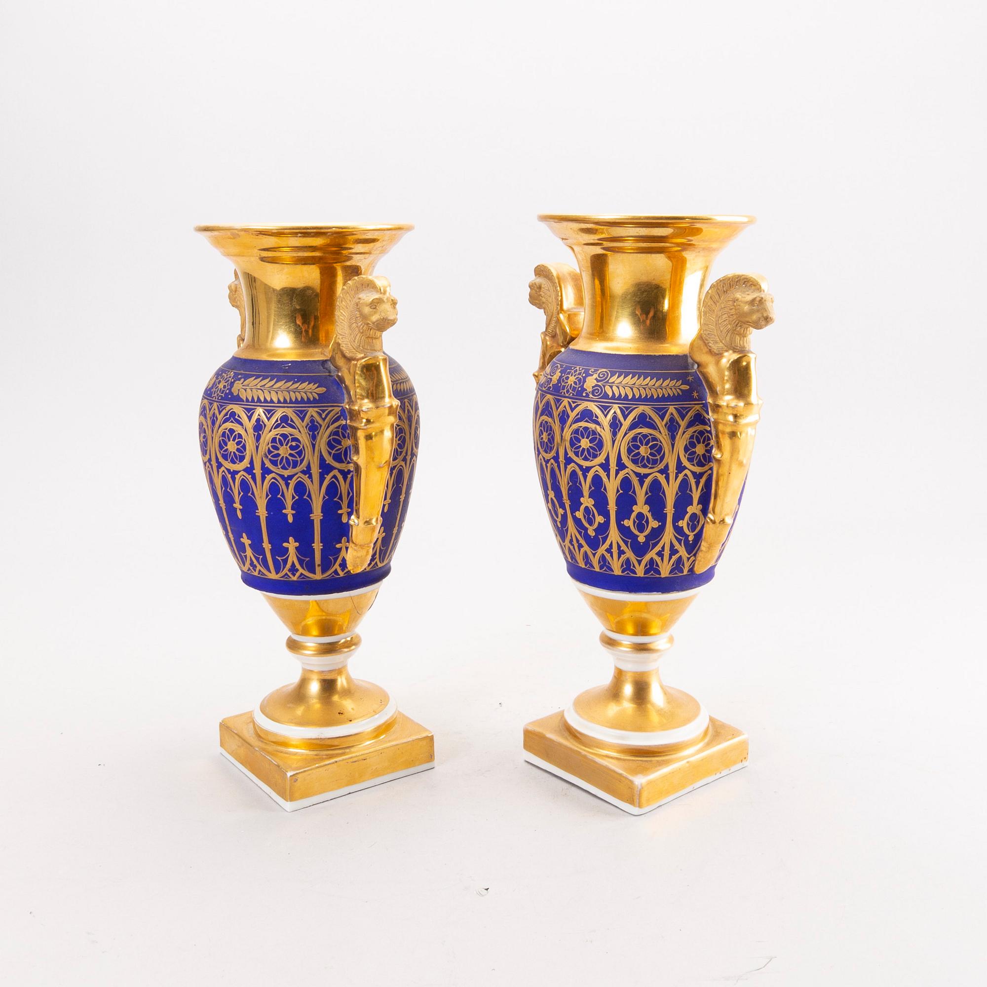 A pair of French Empire porcelain urns.