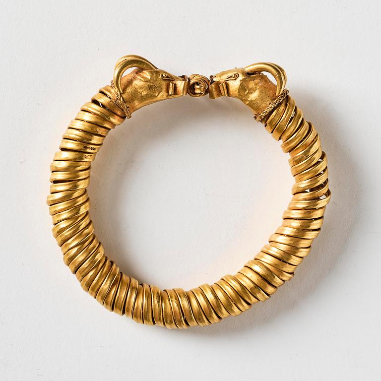 A Greco-Egyptian gold ram's head bracelet, Presumably Ptolemaic period ca 300 BC - 30 BC.