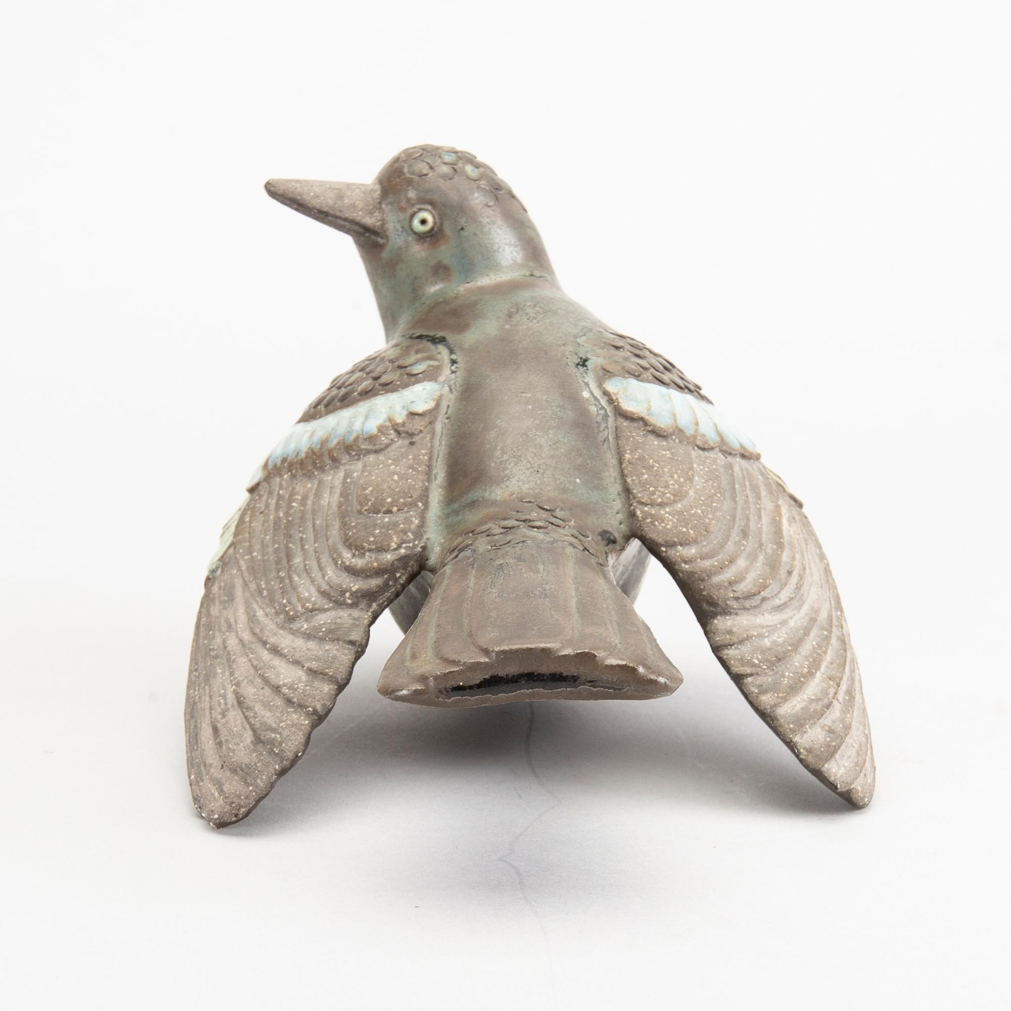 TYRA LUNDGREN, a stoneware sculpture of a bird.