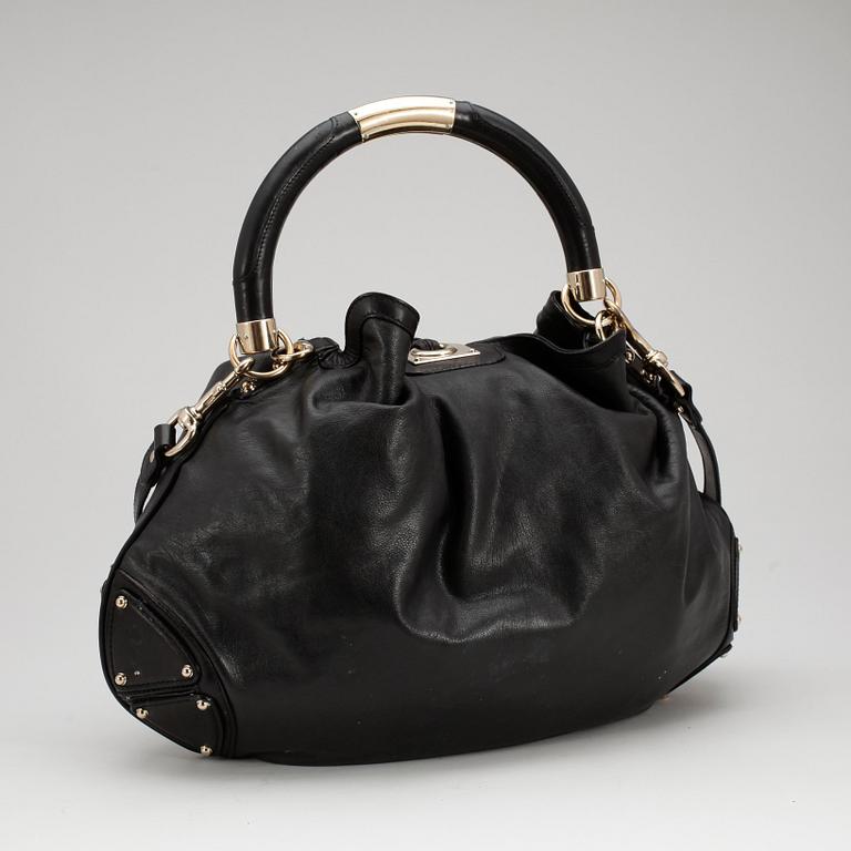 GUCCI, a black leather shoulder bag, "Indy bag".